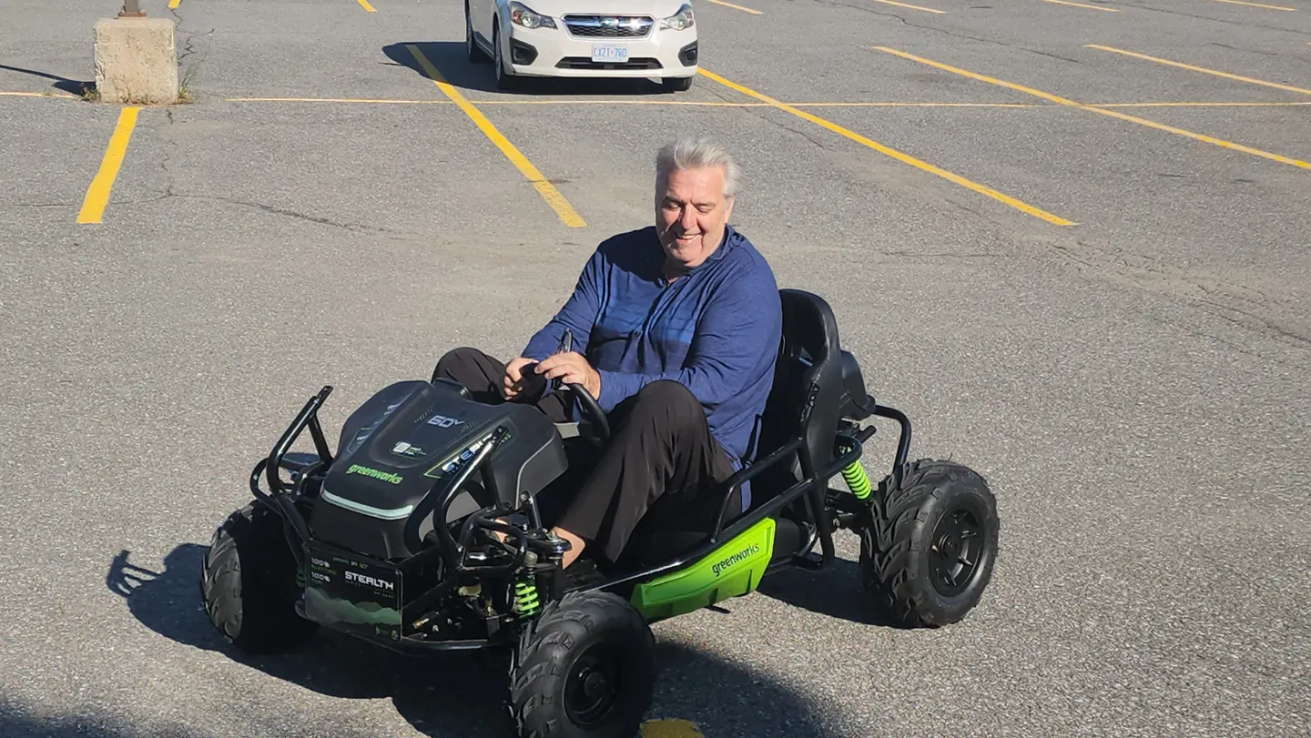 A person driving an electric training vehicle at SkillsHub