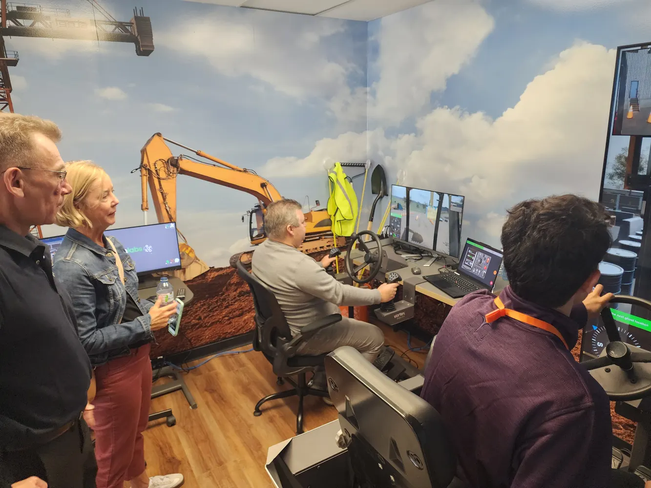 Learners using heavy equipment simulators